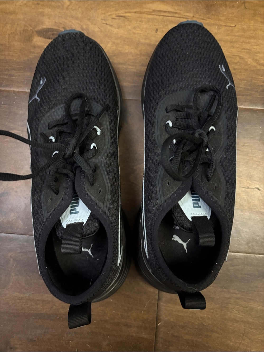 Puma women’s Black and White Mesh Athletic Sneakers